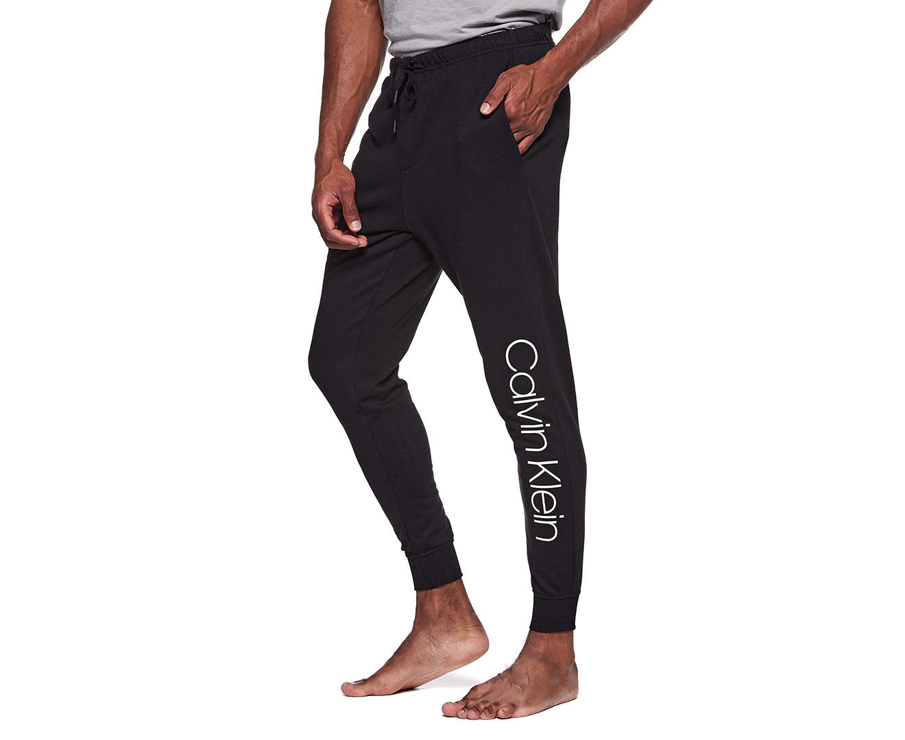 Calvin Klein large logo cuffed track pants in black | ASOS