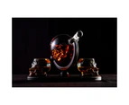 Don Vassie skull decanter set with 2 glasses and mahogany base .