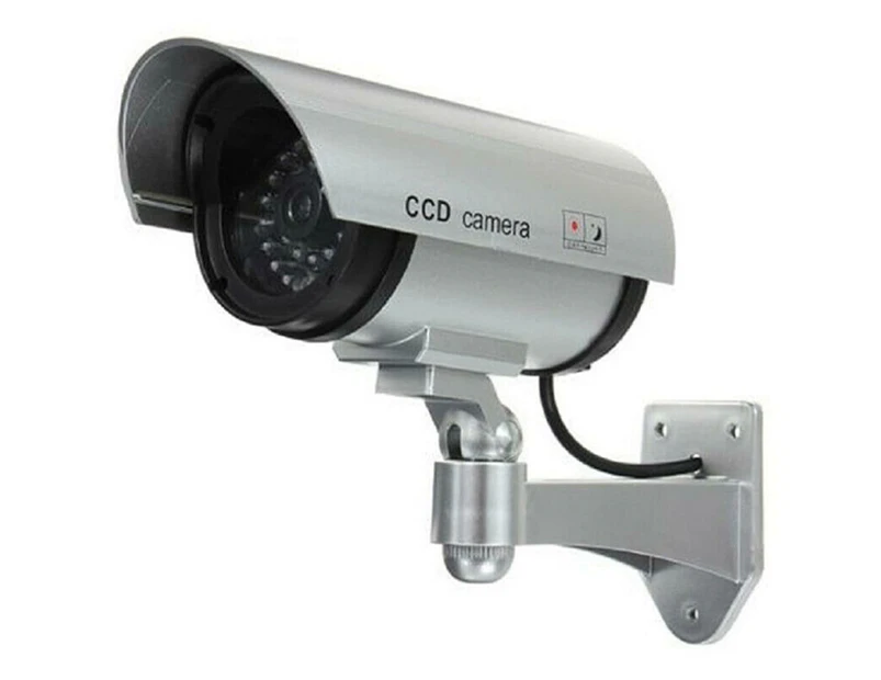 Fake security camera with a red LED light at night for indoor/outdoor security in homes and businesses