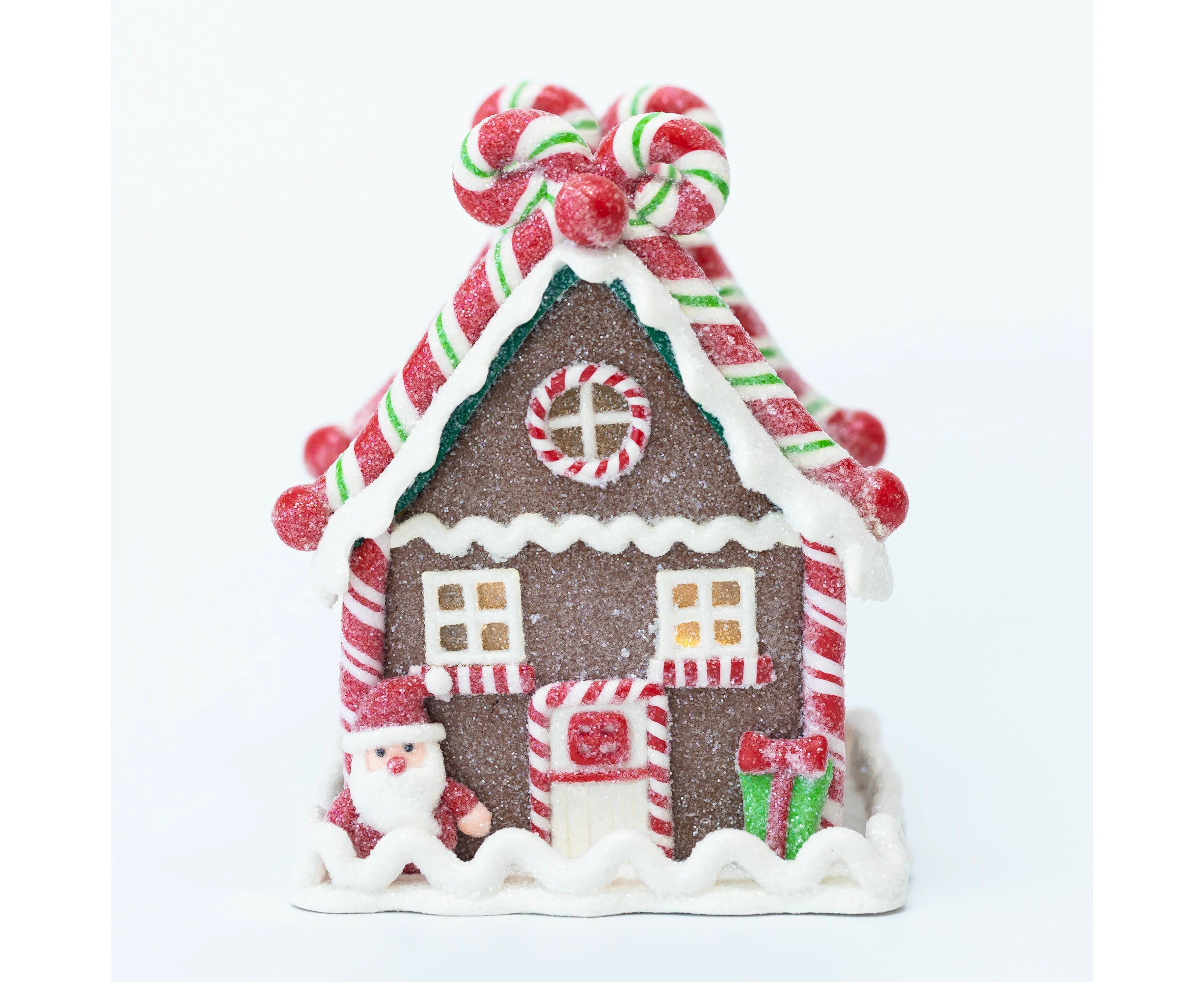 Pre-lit gingerbread house with Santa Claus