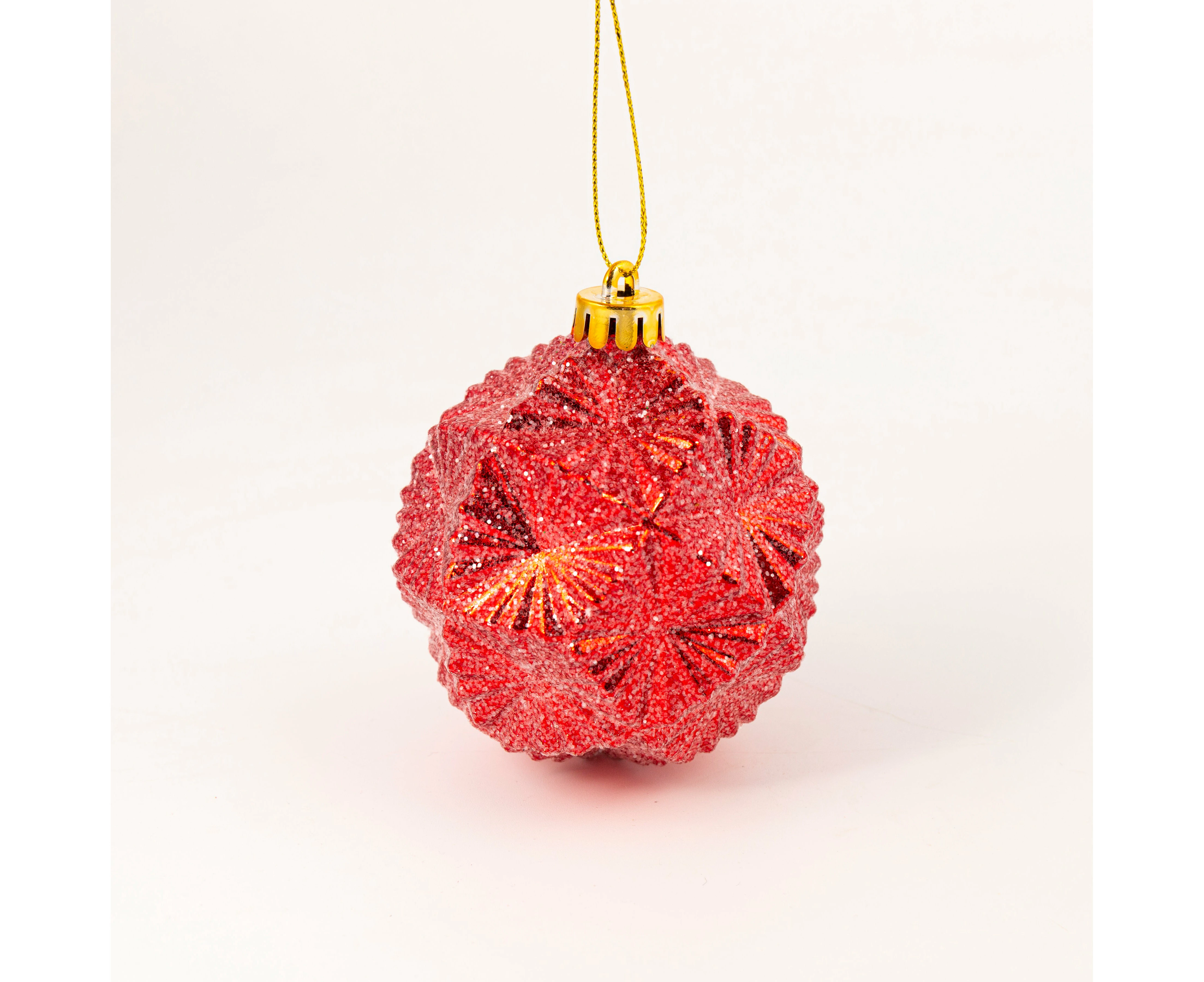 Glitter red bauble with intricate design