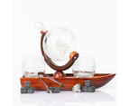 Don Vassie globe decanter set with 2 glasses and a boat shaped mahogany wooden base